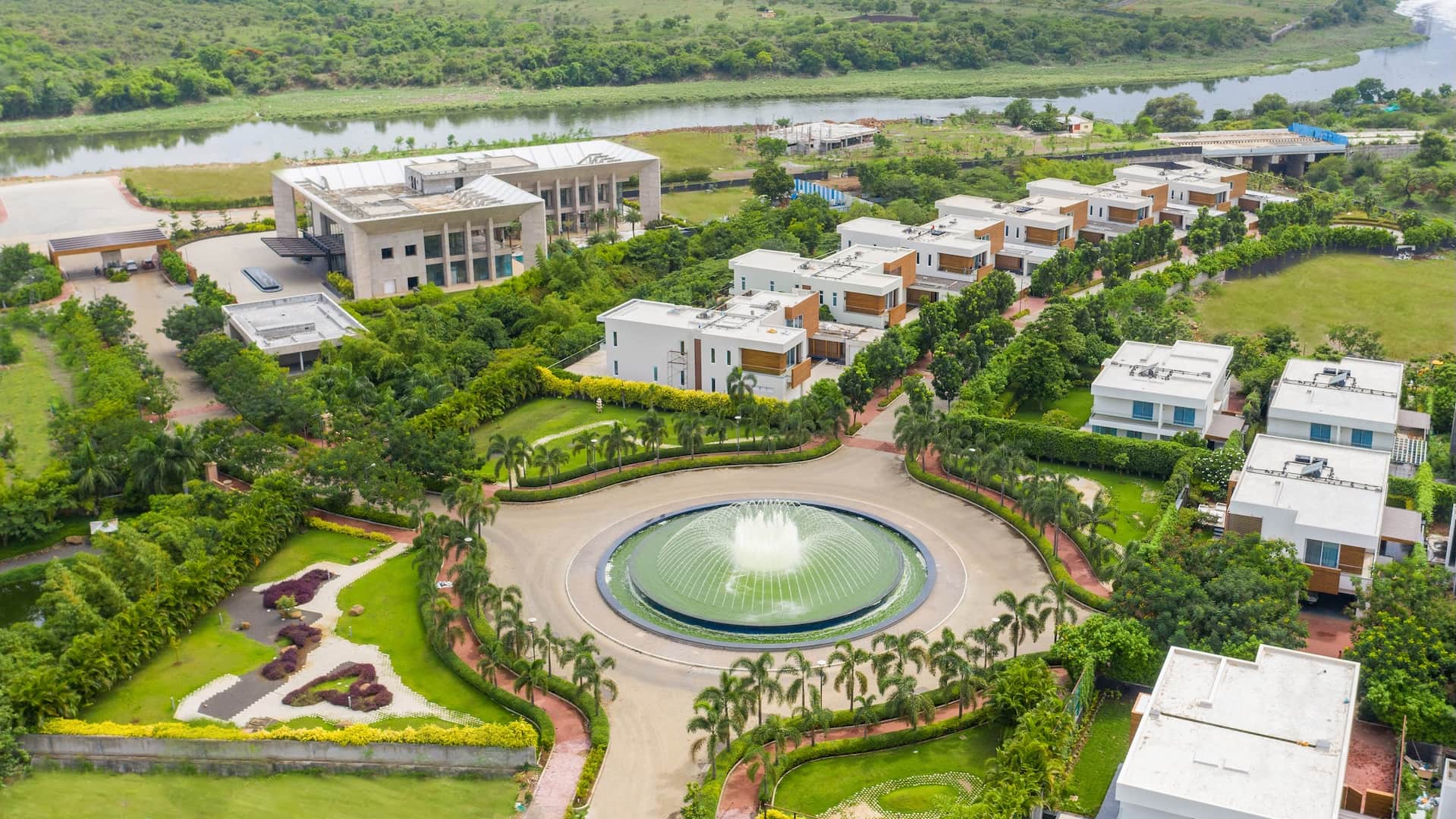 yoovillas in Kharadi Annexe, Pune offering 4.5 BHK Bungalow, 5.5 BHK Bungalow, 6.5BHK Bungalow configurations, status: Recommended - View 1: showcase of premium building architecture, glass facade and modern exterior design